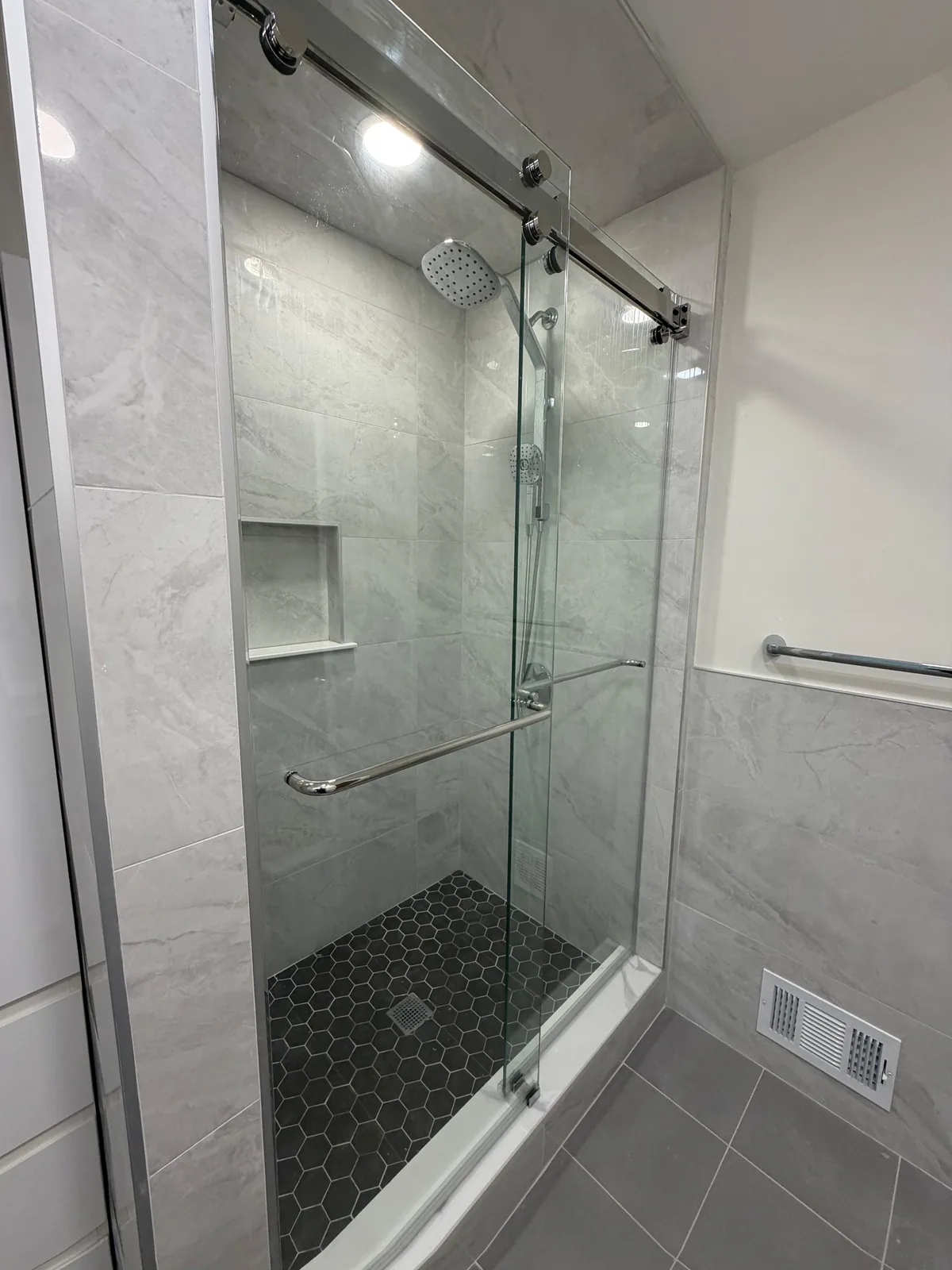 Gray shower, hex floor, rain head