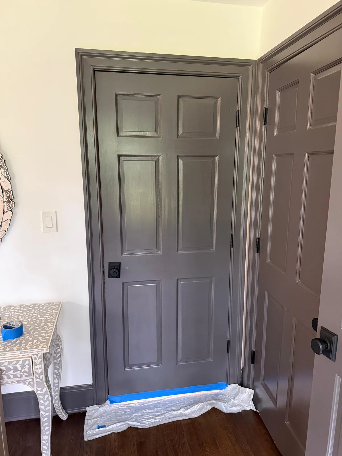 Gray-painted six-panel door
