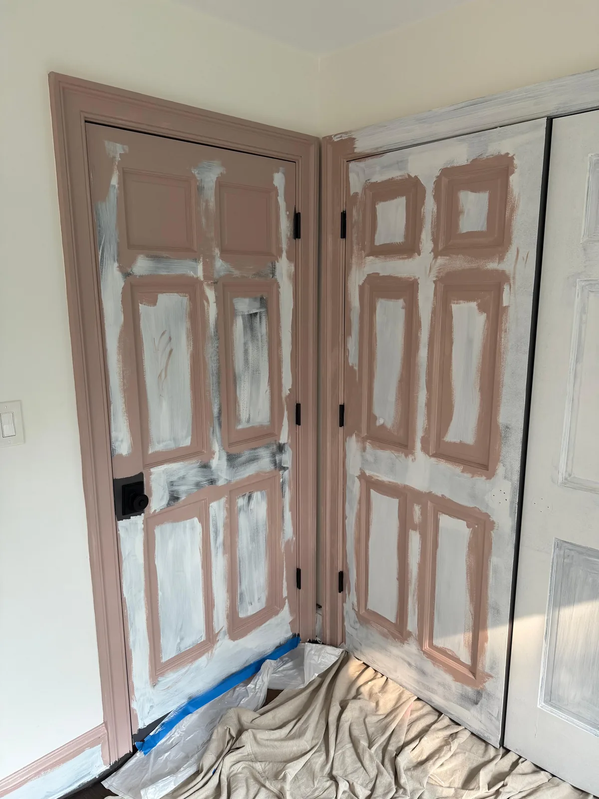 Pink-primed doors in progress