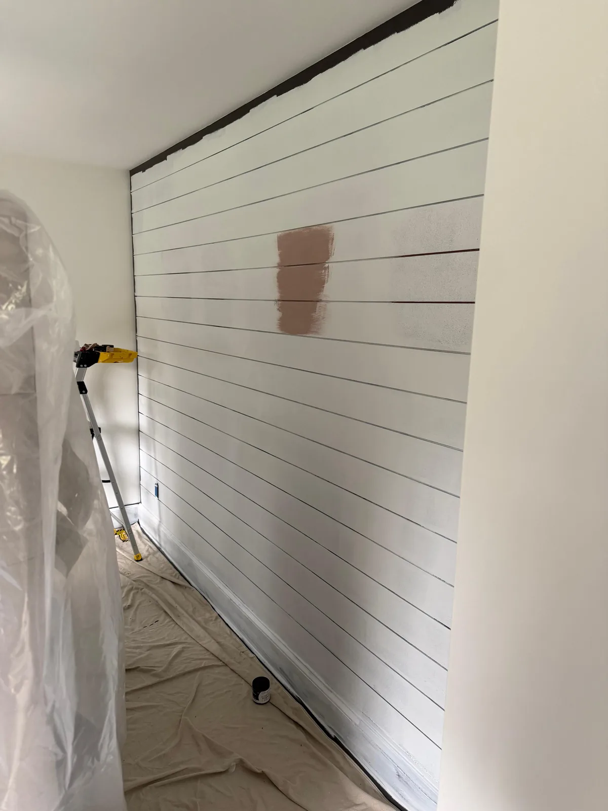 Shiplap wall, mid paint coat
