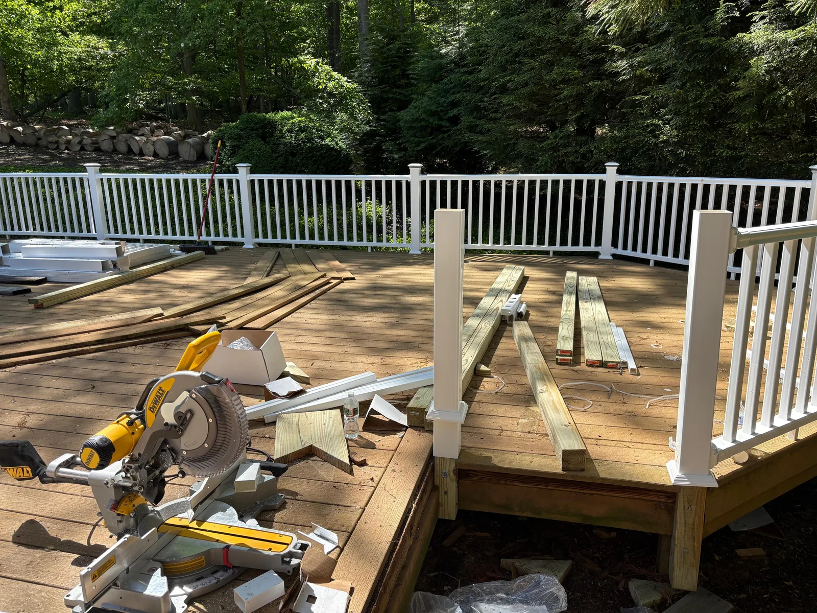 Deck, white railing, mid-build