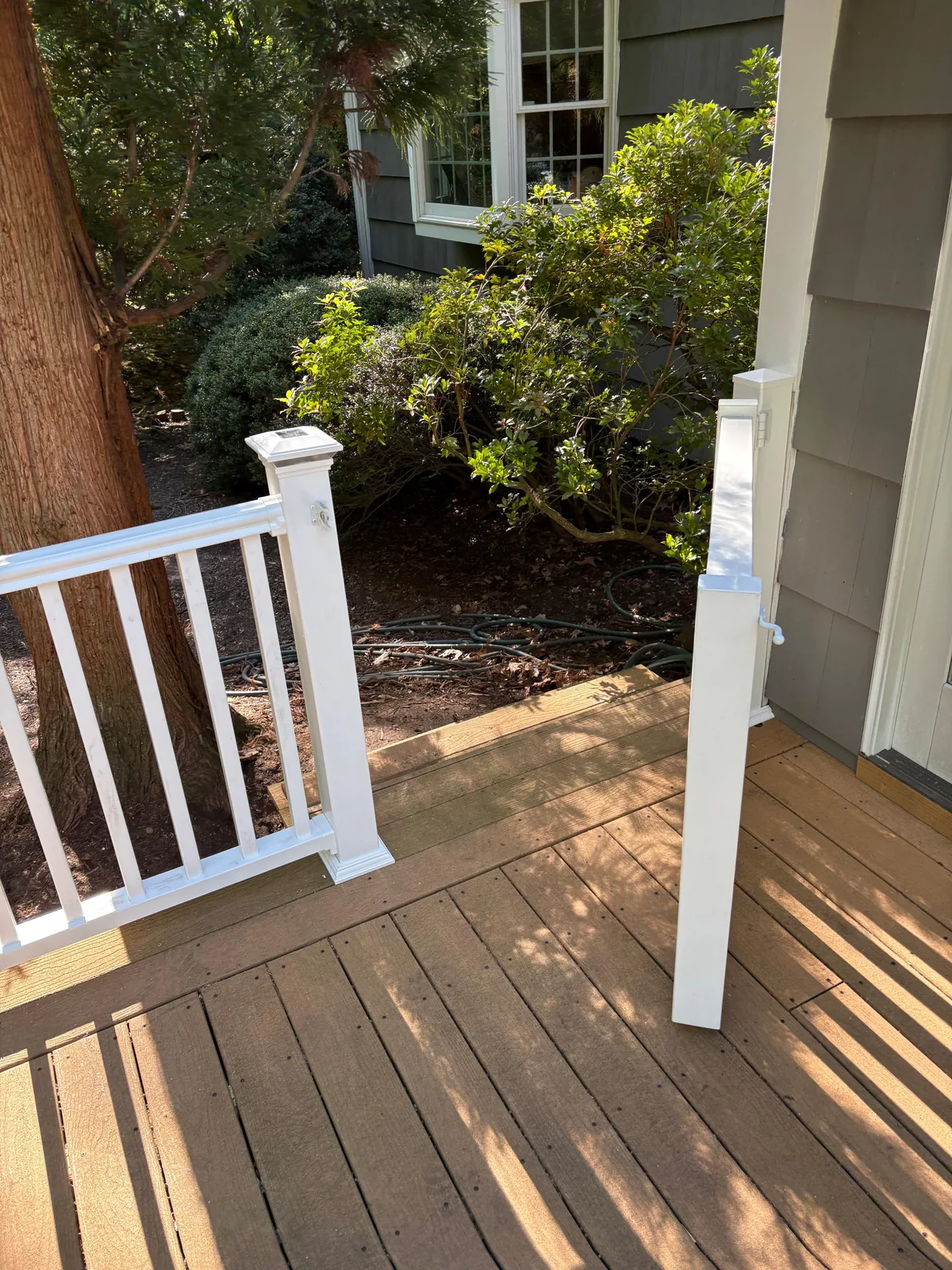 White railing transition on porch
