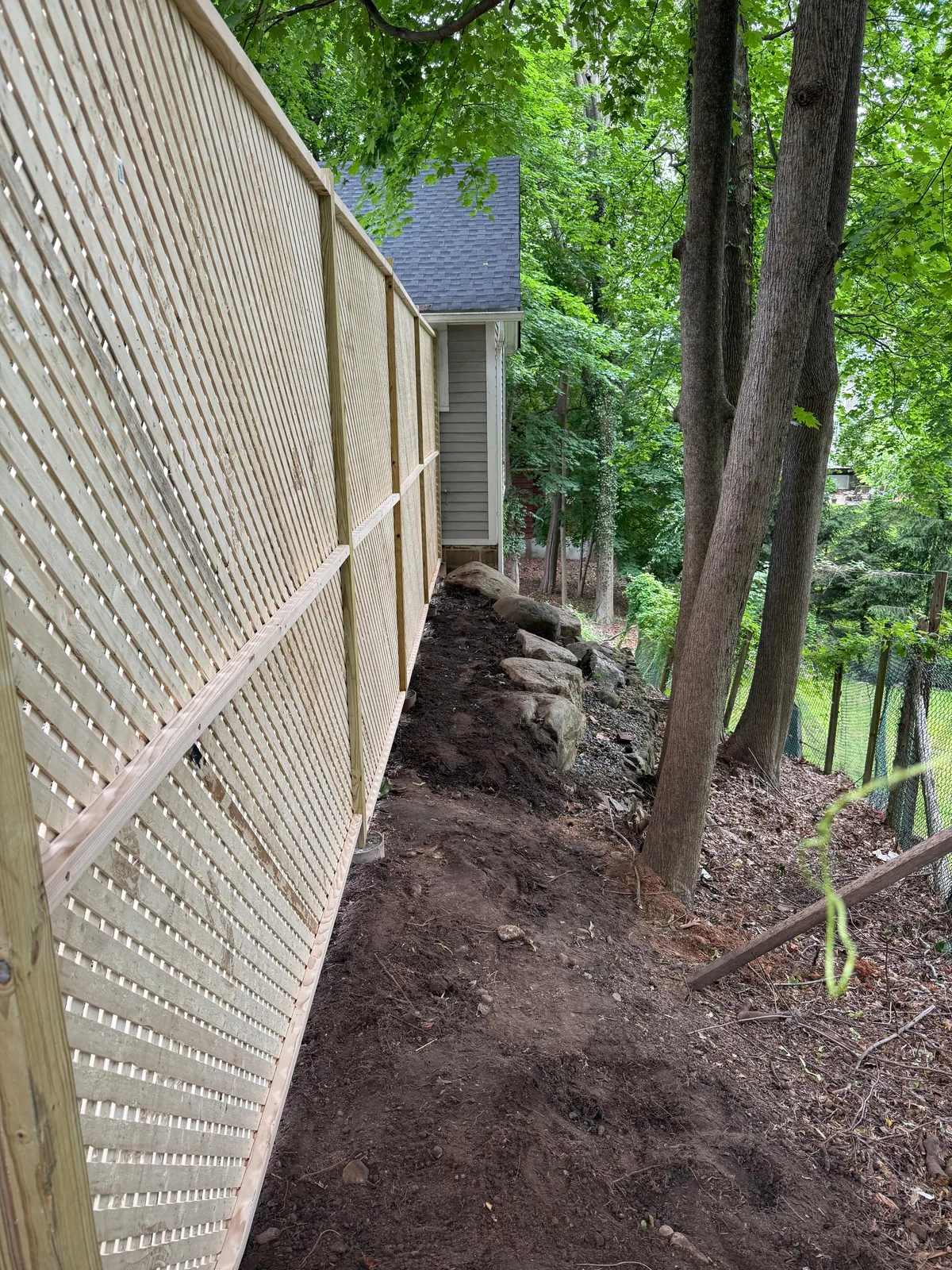Lattice fence along property line