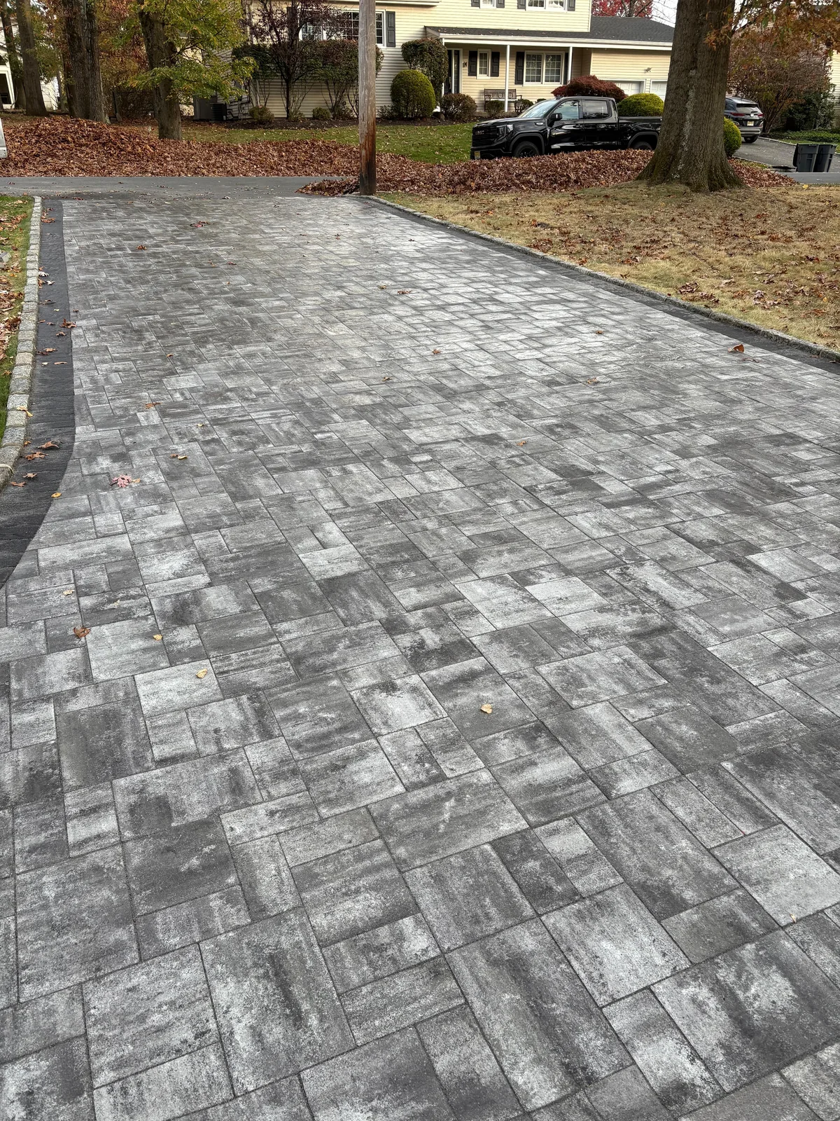 Finished gray paver driveway