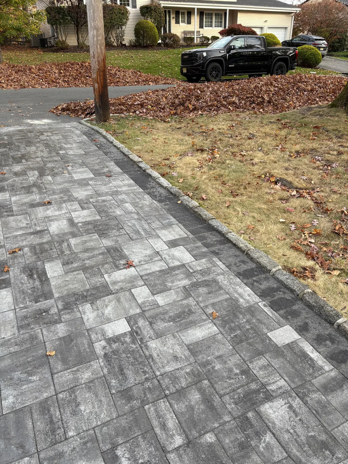 Paver driveway, cobble curb at street
